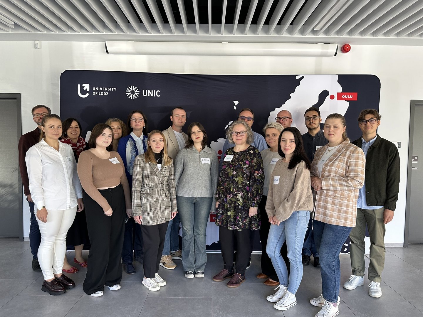 representatives of all teams against the background of the UNIC banner